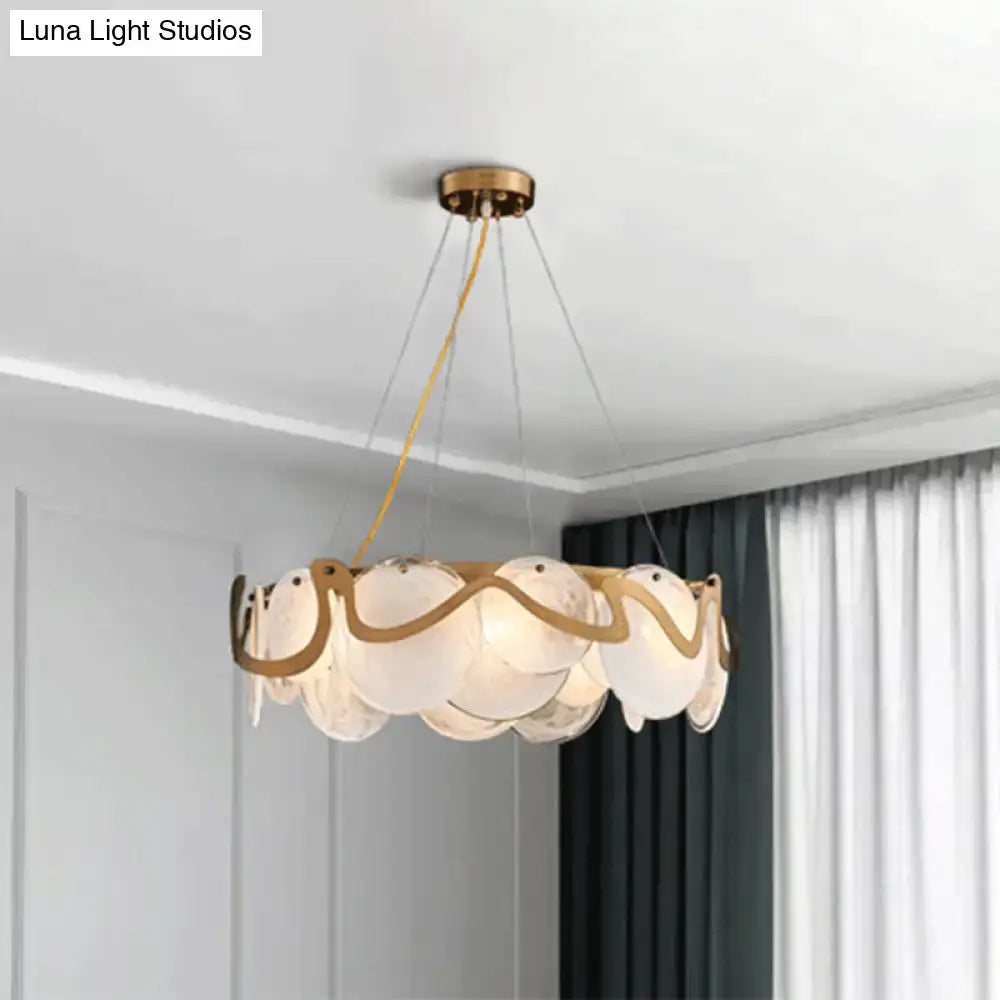 DecorBites™ postmodern circle pendant light with translucent white glass discs and gold brass frame for restaurant island use