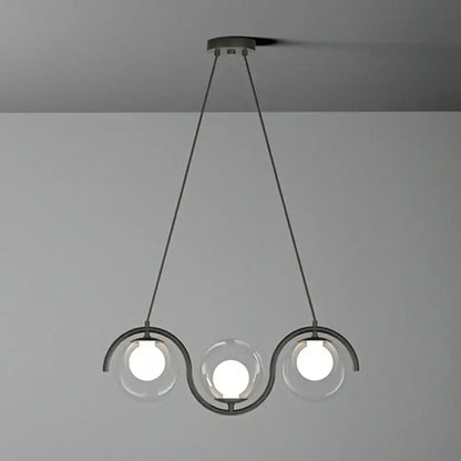 Modern black metal pendant hanging lamp with three clear glass globe bulbs and wavy glass shade by DecorBites