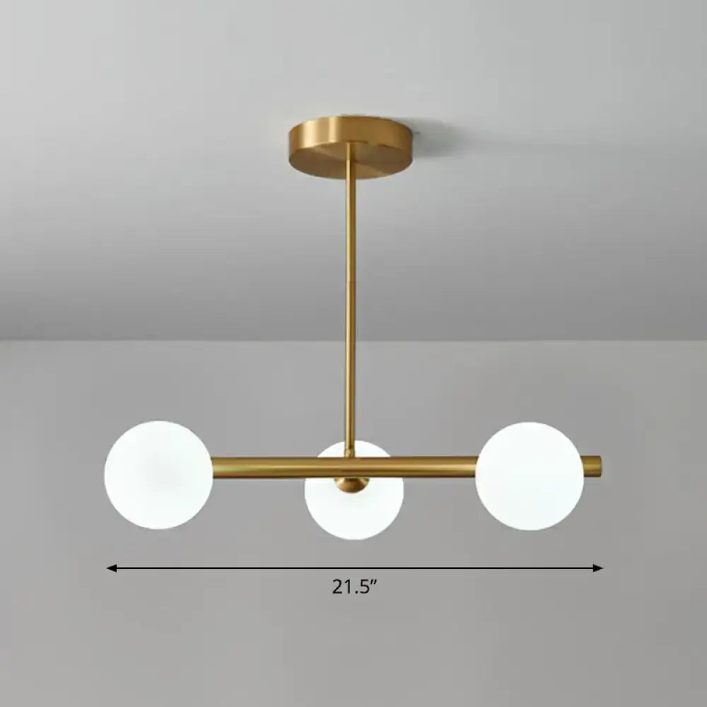 Decorbites™ postmodern linear island lamp featuring a modern brass pendant light with three frosted glass globes for dining room