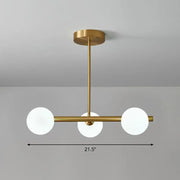 Decorbites™ postmodern linear island lamp featuring a modern brass pendant light with three frosted glass globes for dining room