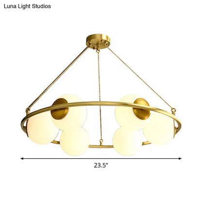 Decorbites™ postmodern metal chandelier with brass finish circular frame and five frosted glass globe shades