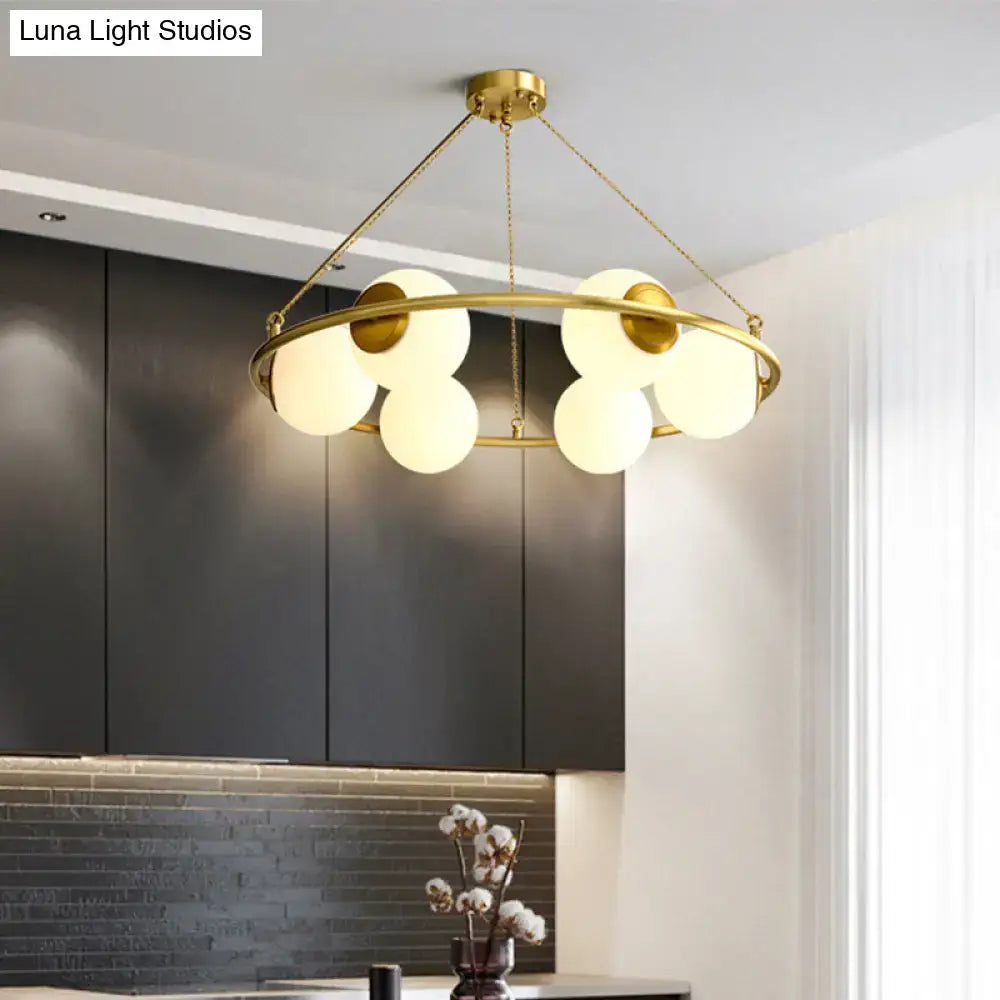 Decorbites™ postmodern metal chandelier with brass finish circular frame and five frosted glass globe shades