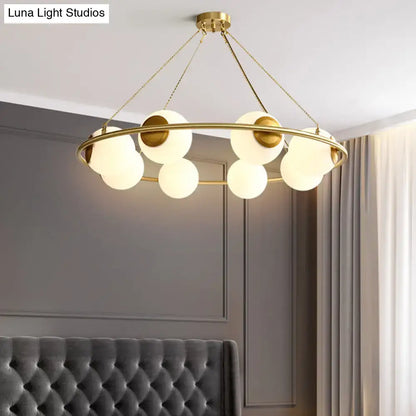 DecorBites™ postmodern metal chandelier with brass finish circular frame and frosted glass globe shades 6/8 lights