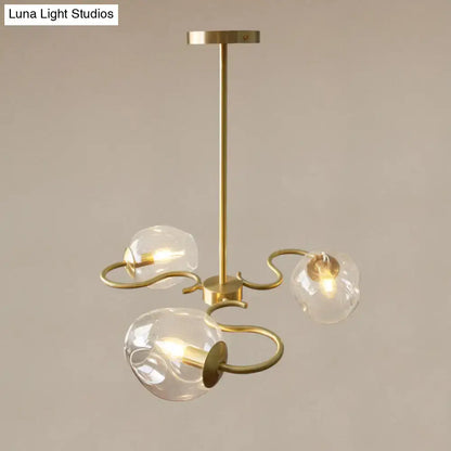 Brass-finished semi-flush mount chandelier with three clear glass globes and curved organic metal arms for bedroom e12 e14