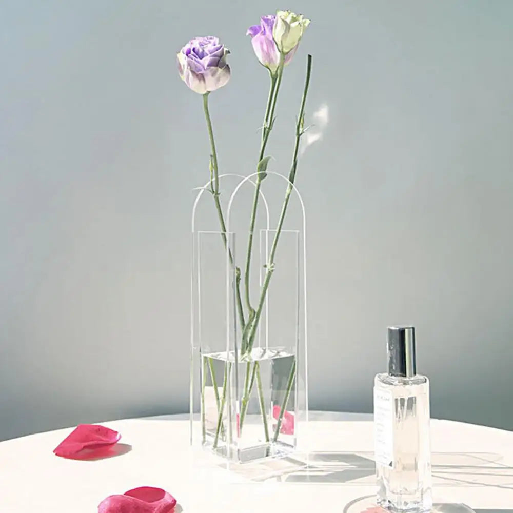 Clear acrylic rainbow color flower vase by decorbites with arched top holding two purple and white lisianthus in nordic style