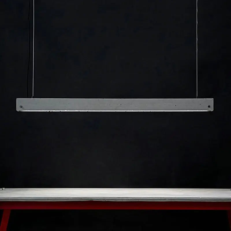 Minimalist gray metal led pendant light with rectangular design suspended by thin wires ideal for dining room lighting