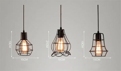 Three black iron art pendant lights with retro iron art wire cages and exposed filament bulbs for industrial style decor