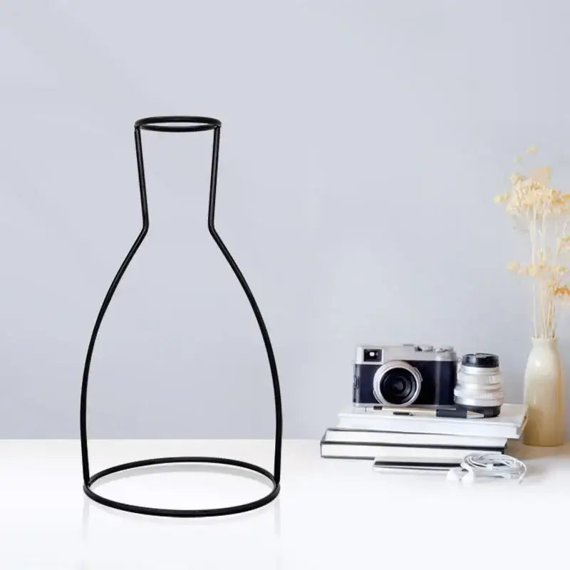 Black wireframe retro iron flower vase pot ornament with sleek minimalist design for home and garden decor