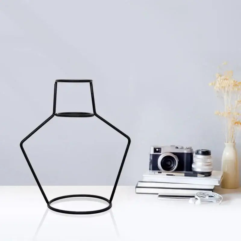 Black wireframe retro iron flower vase with pentagonal base and rectangular neck for home and garden decor