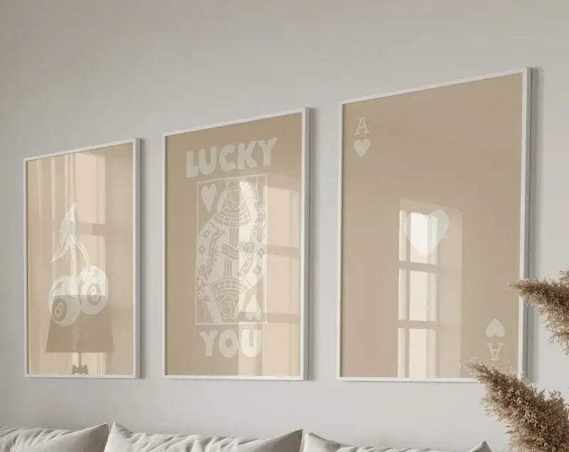 Set of three beige-framed posters set featuring retro lucky aesthetic white playing card designs with lucky you text