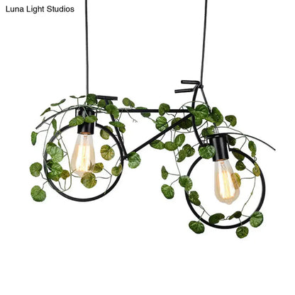 Black metal bicycle restaurant ceiling light with two exposed bulbs and green plant decor for retro ambiance