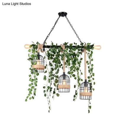 DecorBites™ retro black metal birdcage chandelier with hanging green ivy and rope accents for restaurant lighting