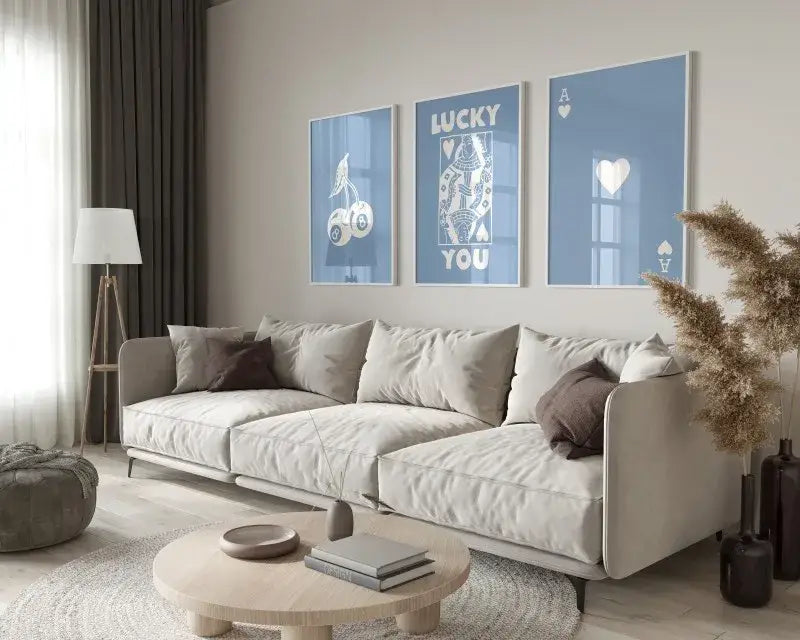 Beige upholstered sectional sofa with dark brown accent pillows next to decorbites™ retro queen of hearts ace card wall art set