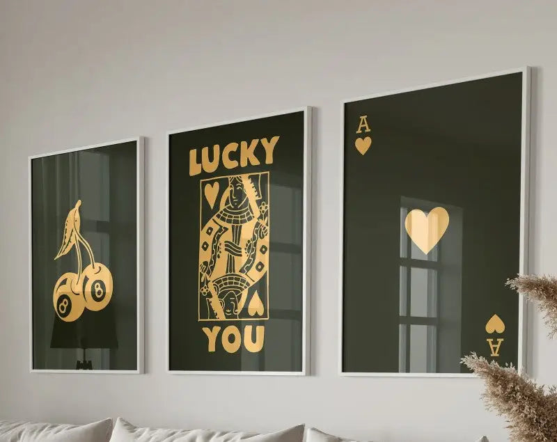 Set of three framed decorbites™ retro queen of hearts wall art posters with gold foil designs on black hearts canvas paintings