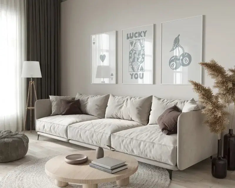 Beige upholstered sectional sofa with soft rounded armrests in a modern minimalist design near decorbites retro wall art posters