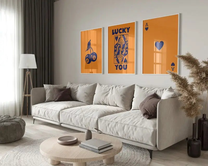 Modern beige sectional sofa with soft upholstered cushions and sleek metal legs in decorbites™ retro wall art posters set
