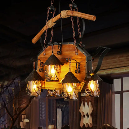 Rustic wooden and black metal teapot-shaped chandelier with four glowing glass lanterns and white fabric clear glass shade