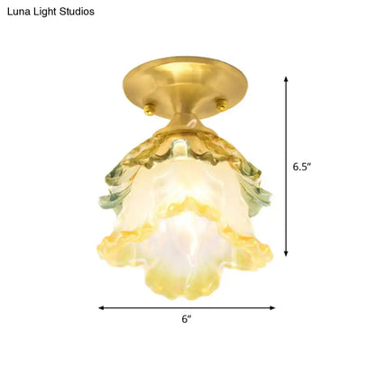 A decorbites™ retro style gold ruffle glass ceiling lamp with hand-blown yellow and green shade and brass base