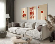 Light gray upholstered sectional sofa with dark brown pillows paired with decorbites™ retro wall art queen of hearts aesthetic