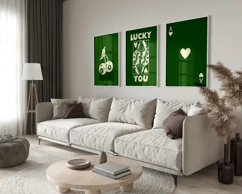 Three framed green poker-themed DecorBites™ retro wall art pieces hang above the sofa in queen of hearts theme