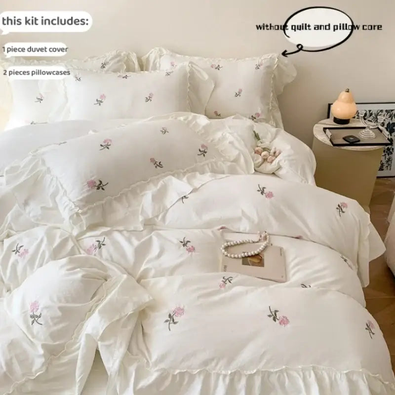 DecorBites™ rose embroidered duvet cover set in white with floral embroidery and ruffled edges princess style cover set