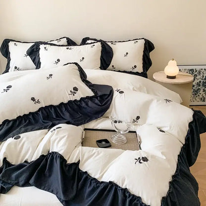 Decorbites™ rose embroidered duvet cover set in white and navy blue with ruffles and black rose embroidery princess style