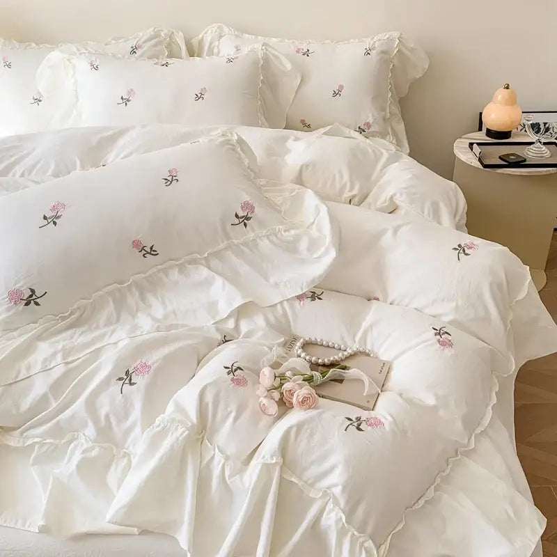 White ruffled duvet cover set with delicate pink and black rose embroidered floral design by decorbites princess style