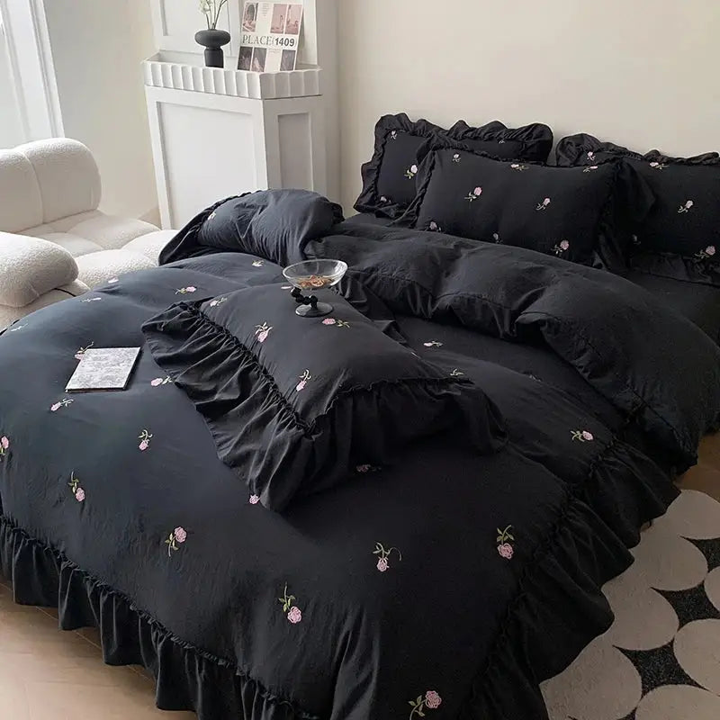 DecorBites™ rose embroidered duvet set in black with delicate pink floral embroidery and ruffled design for princess style beds
