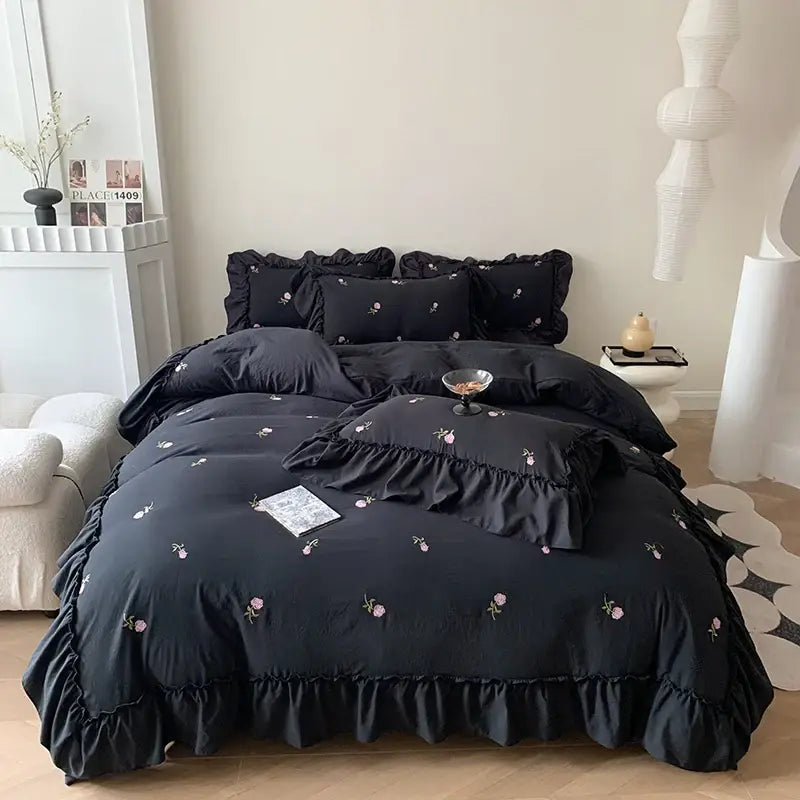 Black ruffled bedding set with delicate pink floral embroidery featuring a rose embroidered duvet by decorbites princess style