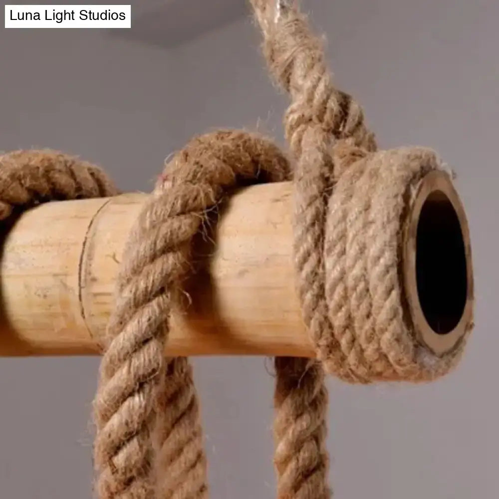 Natural fiber rope tightly wrapped around a light bamboo pole of the DecorBites™ rustic brown island pendant light