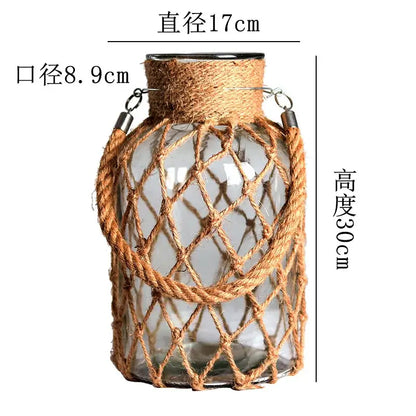 DecorBites™ rustic hanging glass vase with clear glass, natural hemp rope, woven twine, and metal rings for hanging