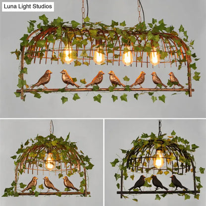 DecorBites rustic island ceiling light features a copper-toned cast iron birdcage with green ivy and exposed filament bulbs
