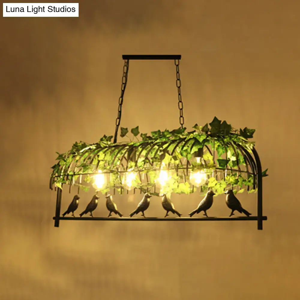 Wrought iron bird-themed industrial style island ceiling light with green ivy and warm glowing bulbs by decorbites
