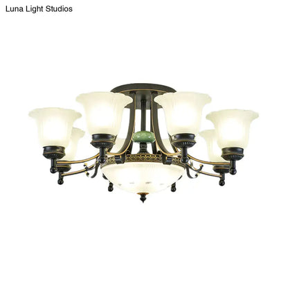 Antique brass ceiling light fixture with six frosted glass shades and central green jade accent for living room