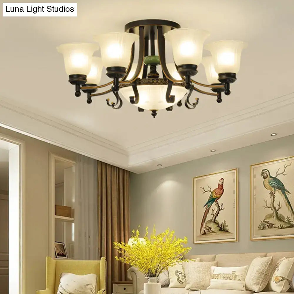 Antique bronze-finished DecorBites ceiling light fixture with five frosted glass shades and green accent for living room