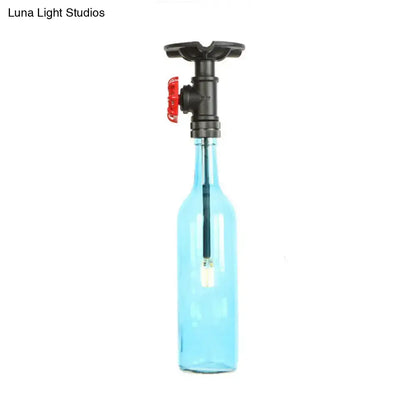 Decorbites™ rustic single light semi flush lamp featuring a translucent blue glass bottle with black valve and red handle