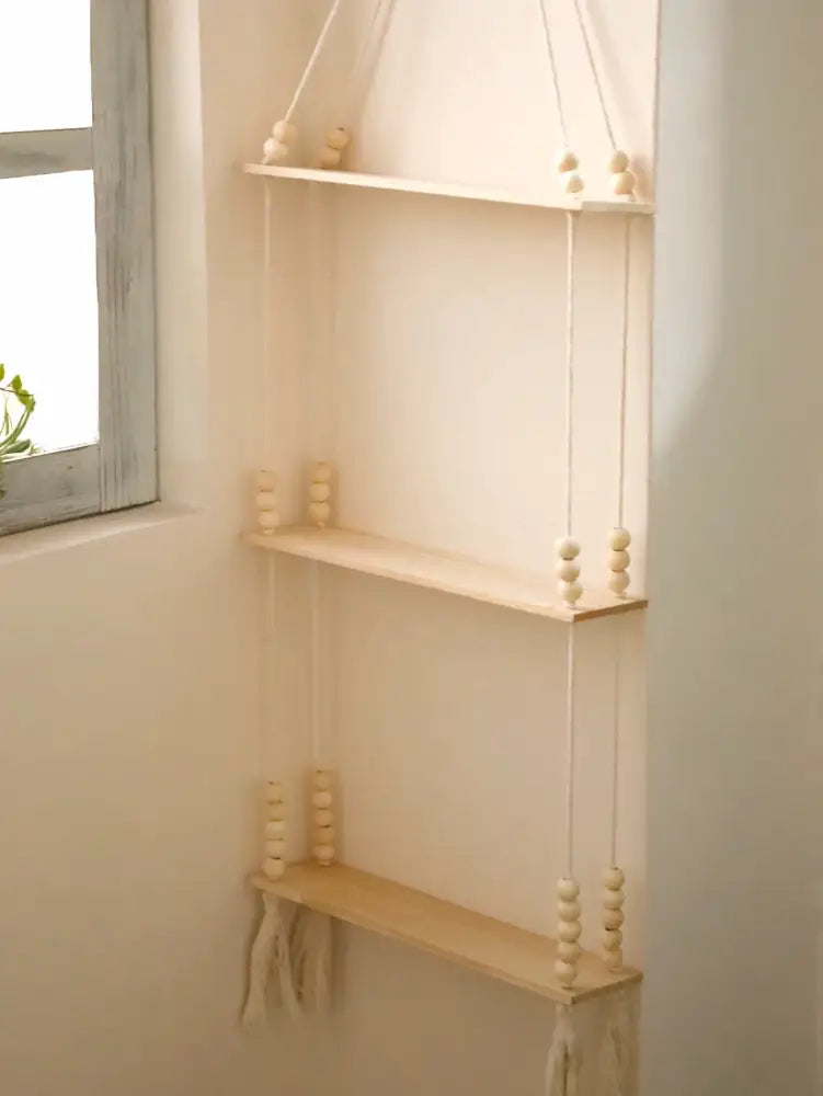 Decorbites™ rustic wooden wall shelf with three-tier minimalist hanging design and natural wood bead accents in beige