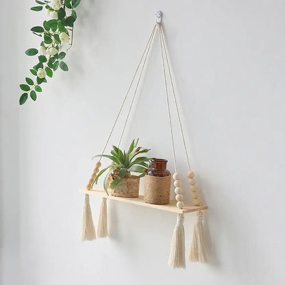DecorBites™ rustic wooden wall shelf with natural finish, cream macrame cords, tassels, and decorative wooden beads