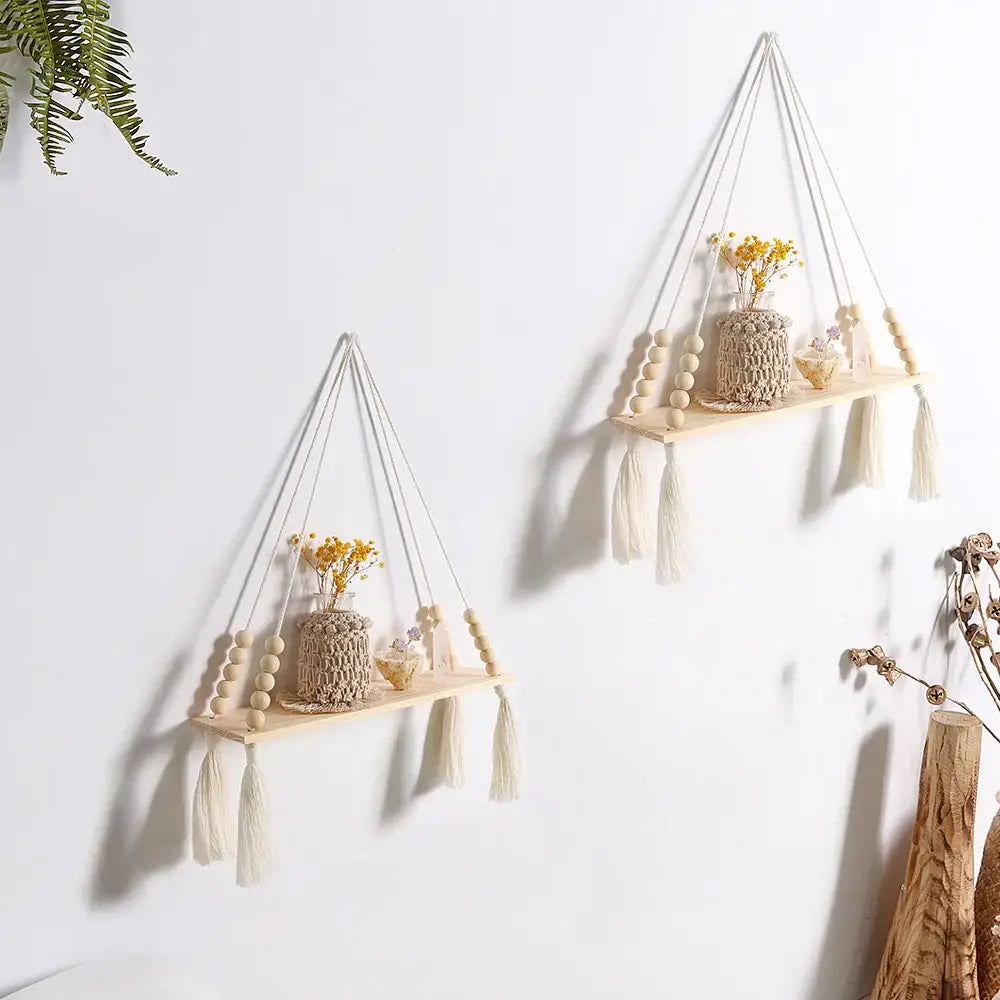Beige macrame rustic wooden wall shelf with wooden beads and tassels for hanging plant storage by decorbites