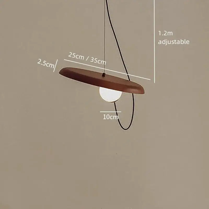 Brown wooden disc pendant light with white bulb and black cord in decorbites scandinavian pendant light design