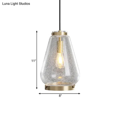 DecorBites™ Seeded glass pendant light with textured clear glass shade and brass rim perfect for bedrooms