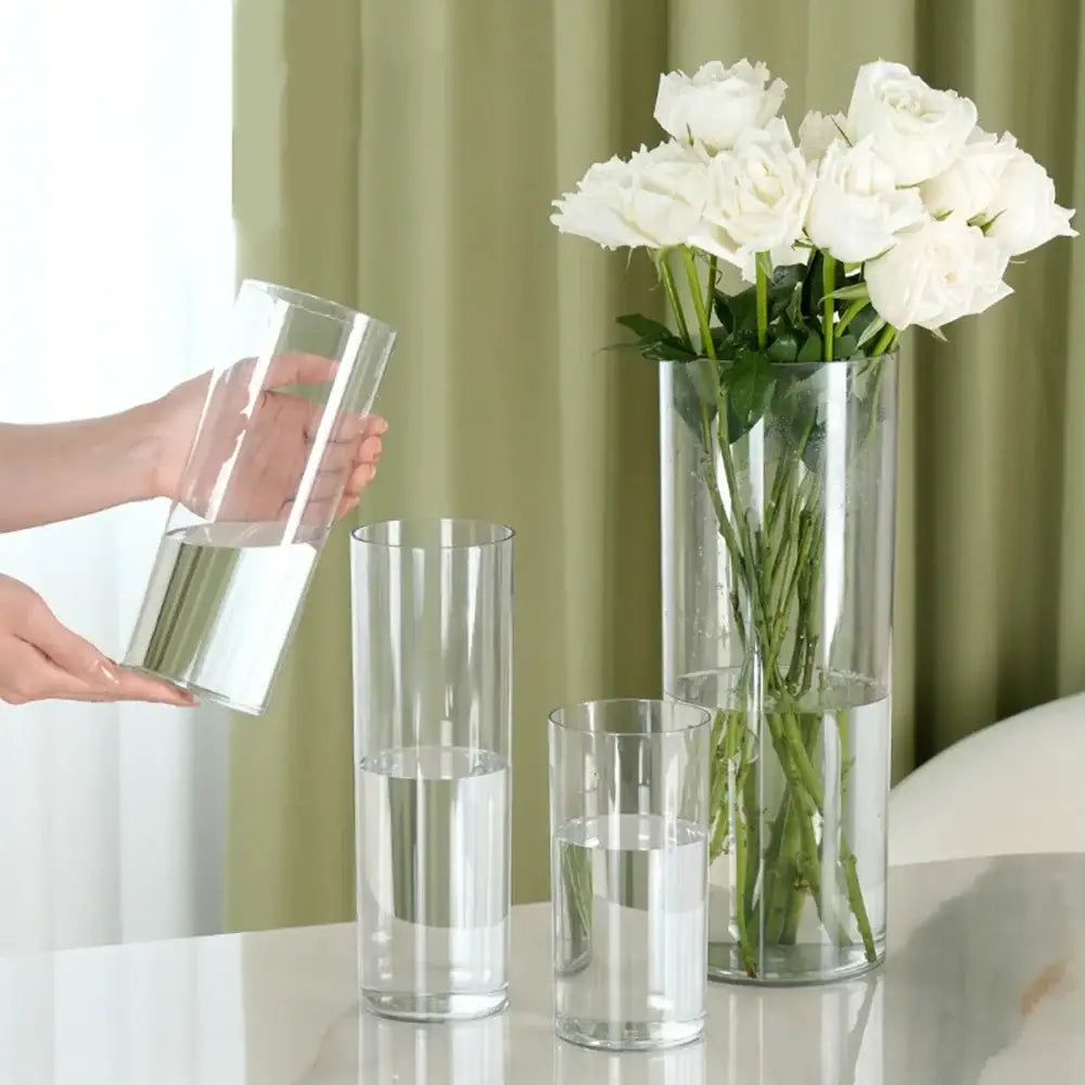 Decorbites™ shatterproof tall transparent flower vase made of clear transparent acrylic arranged on a reflective surface