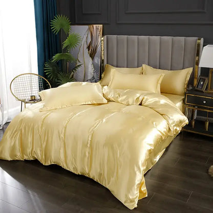 Golden satin decorbites silk bedding set with pcs duvet cover and matching pillows on plush gray headboard bed width