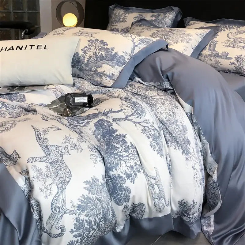 Blue and white toile patterned satin duvet cover set with subtle sheen made from silky eucalyptus fiber