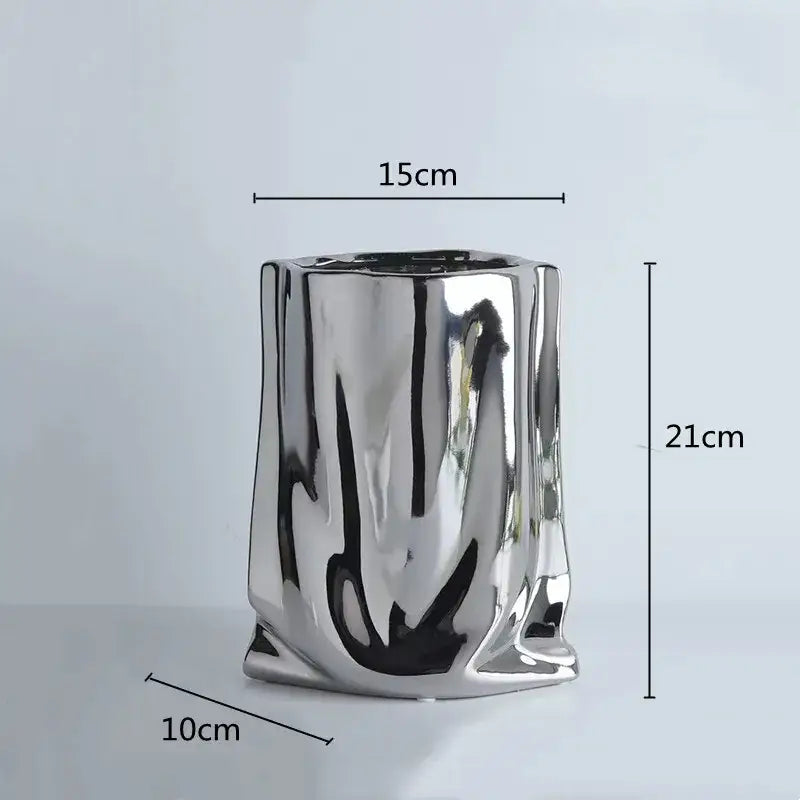 Silver ruffled ceramic flower vase by DecorBites™ with textured sculpted surface and irregular vertical ridges