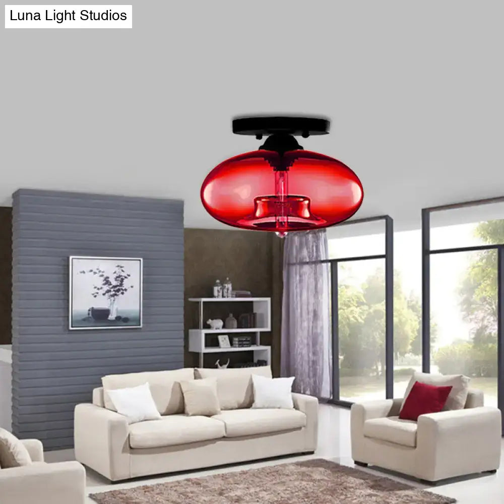 Vibrant red glass oval flush mount pendant light with sleek black ceiling mount for hallway by decorbites flush mount