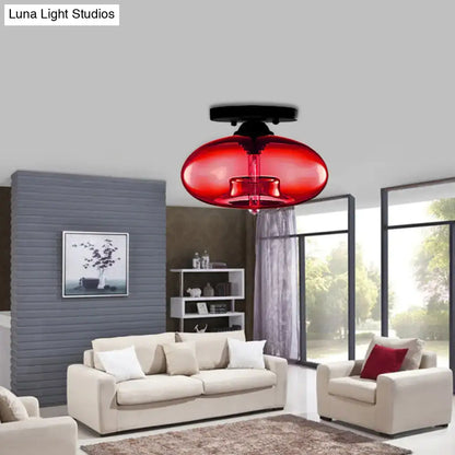 Vibrant red glass oval flush mount pendant light with sleek black ceiling mount for hallway by decorbites flush mount