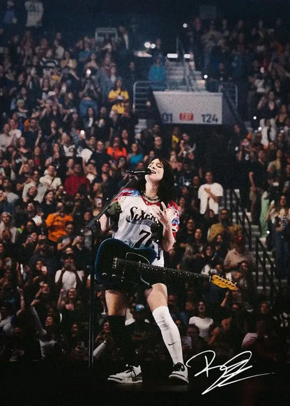 A signed canvas art of a singer b-billies performing in a philadelphia 76ers jersey for home decor by decorbites