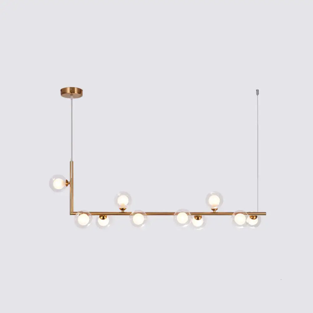 Modern brass linear pendant light with clear glass globe bulbs for dining room hanging island by decorbites