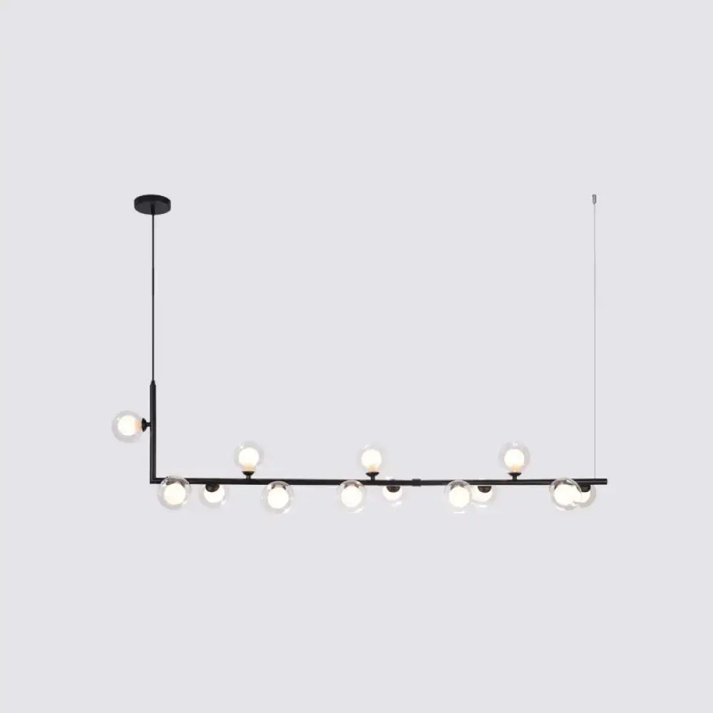 Black modern DecorBites™ pendant light with spherical glass bulbs on a sleek bar for dining room hanging island use
